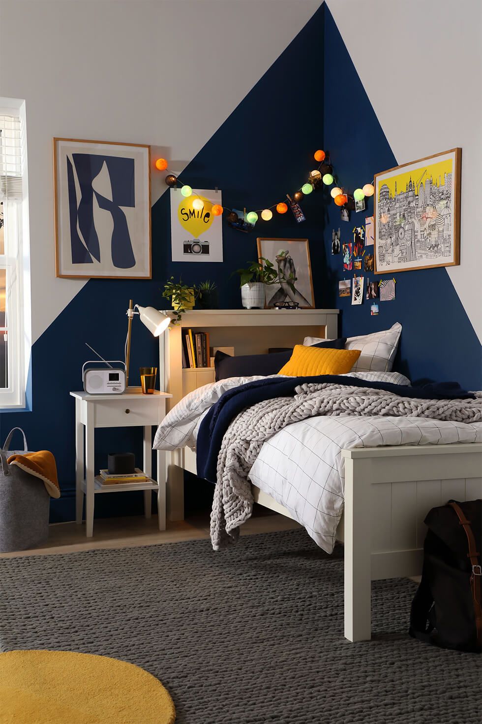 Teenage bedroom with geometric feature wall and colourful accents