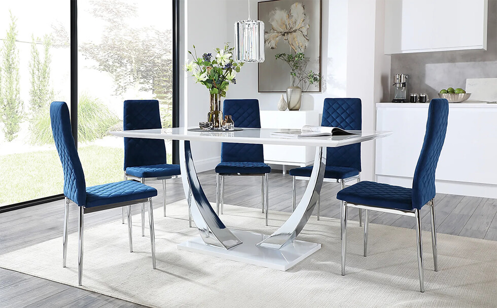 Modern chrome and white marble dining table with blue velvet chairs