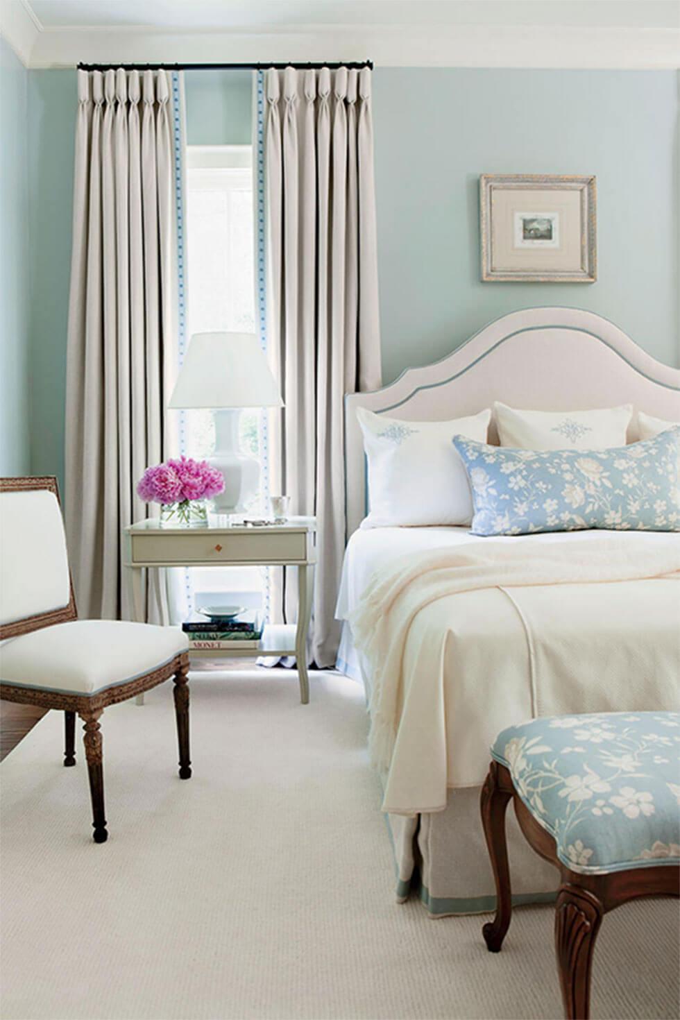 Bedroom walls painted in a pastel blue for a relaxing mood.