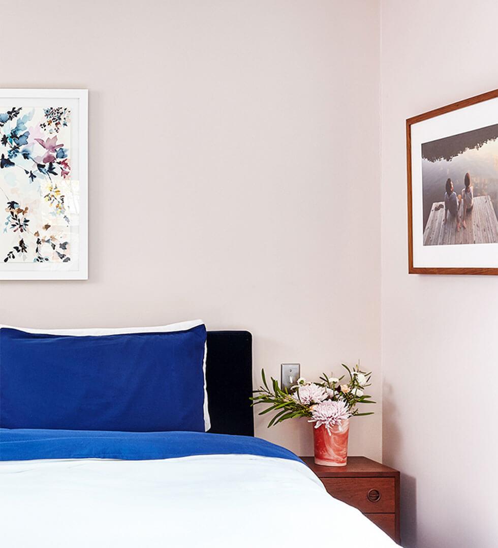 Bedroom walls painted in pastel pink.