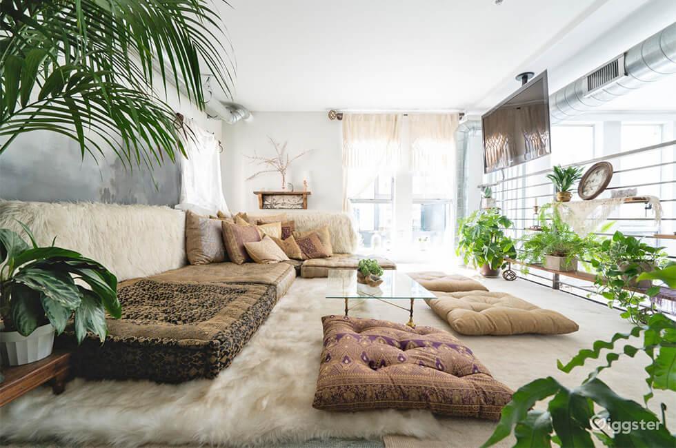 Sunlight streaming in through sheer white curtains in a modern boho neutral space