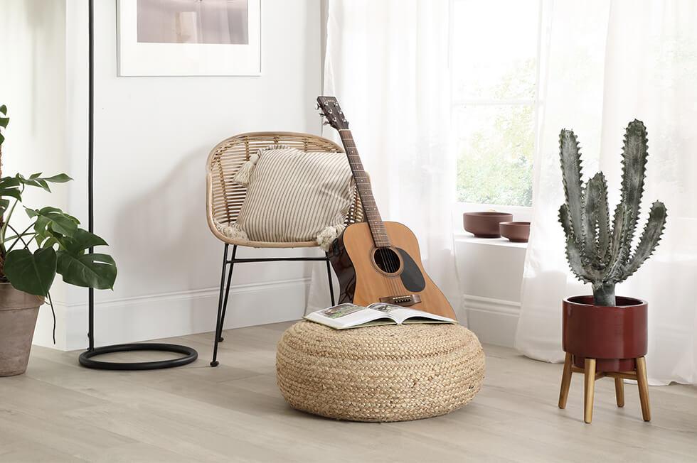 guitar and plants in a neutro modern boho space