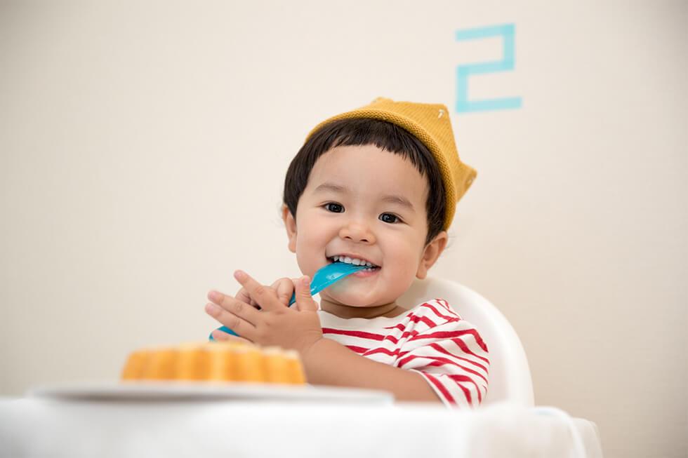 Toddler eating dessert