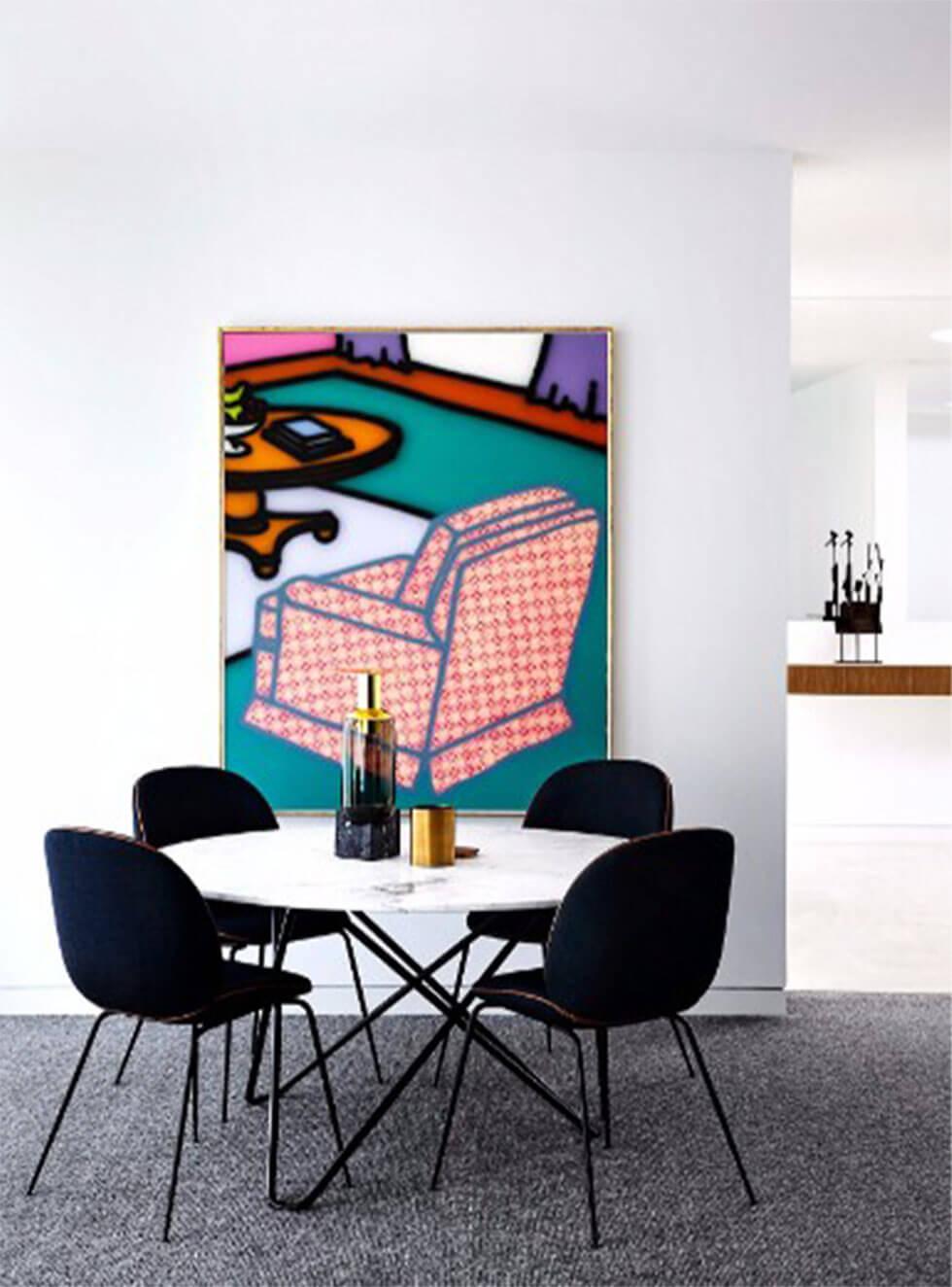 Modern dining room with bold contemporary artwork