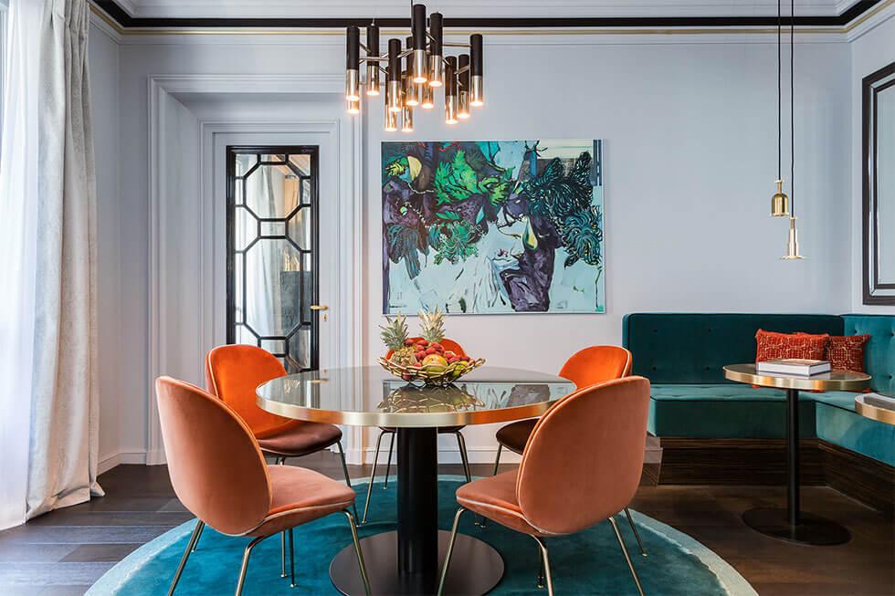 Modern dining room with velvet teal rug