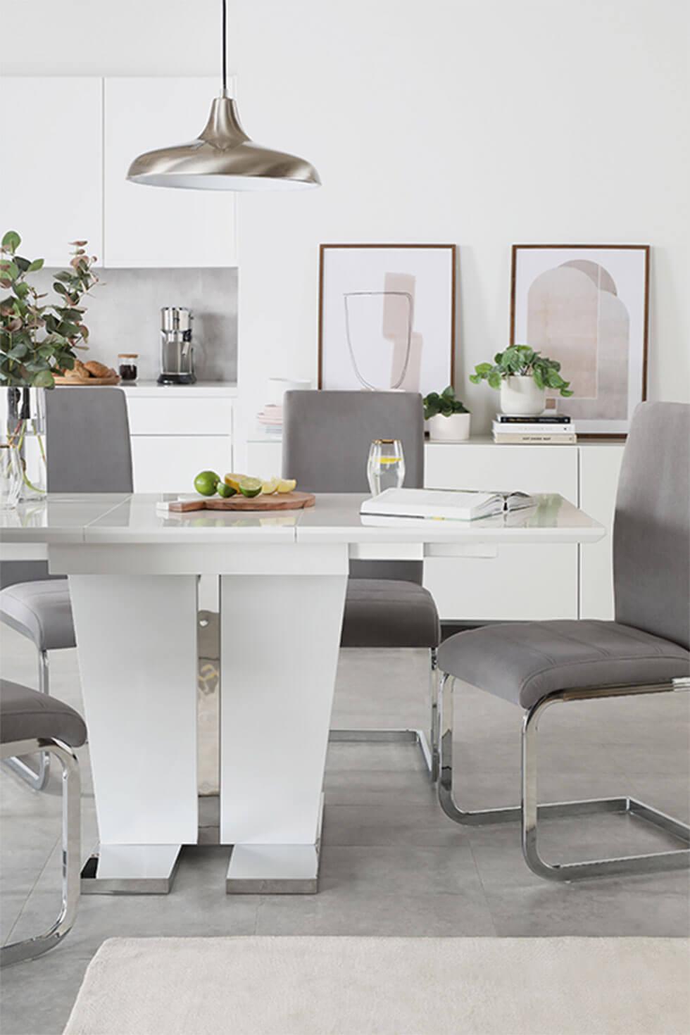 Contemporary dining room with grey dining chairs and white high gloss table