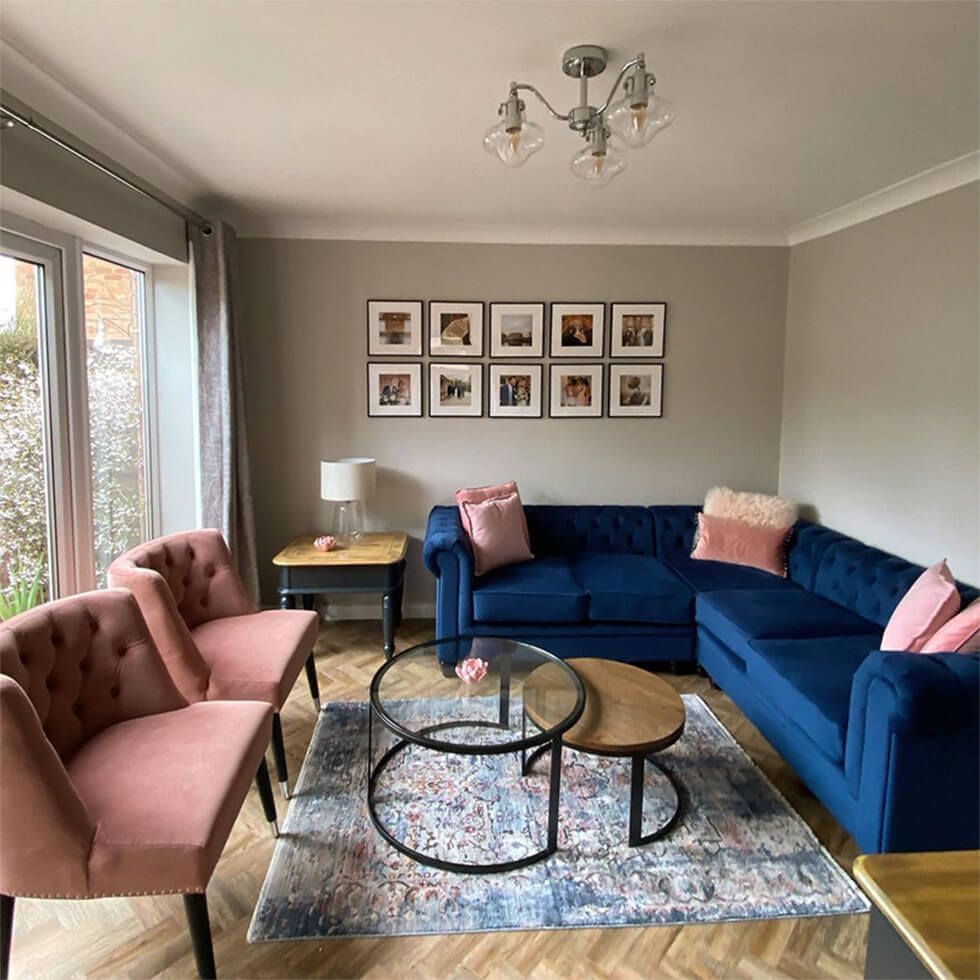 Country style blue velvet sofa in a modern living room