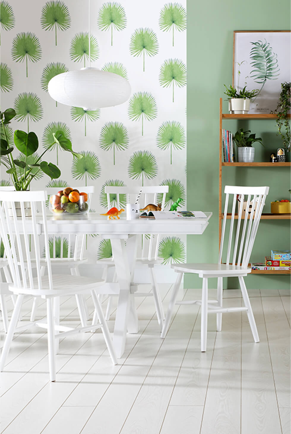 White wooden dining set against terracotta statement wall