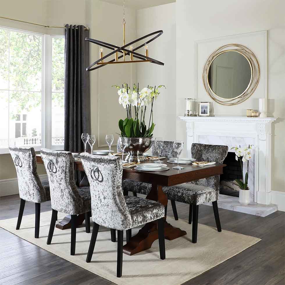 Dark wood extending dining table in an elegant setting