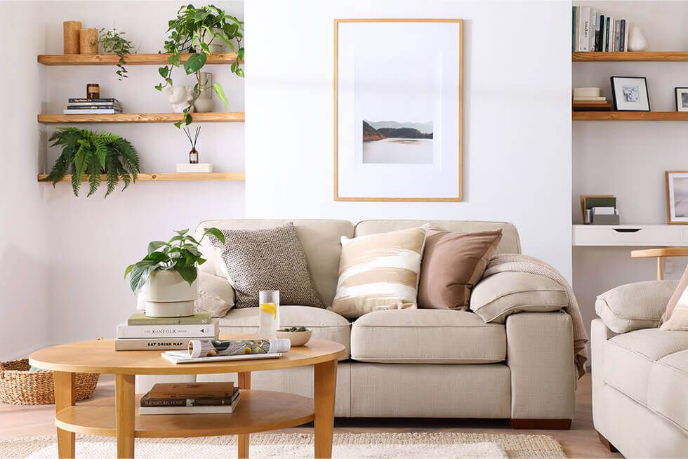 Spring living room with fabric sofa and wooden coffee table