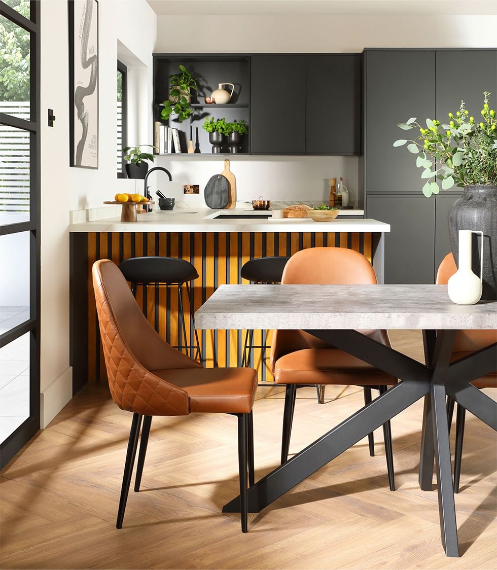Industrial style dining set with leather dining chairs in an open plan space