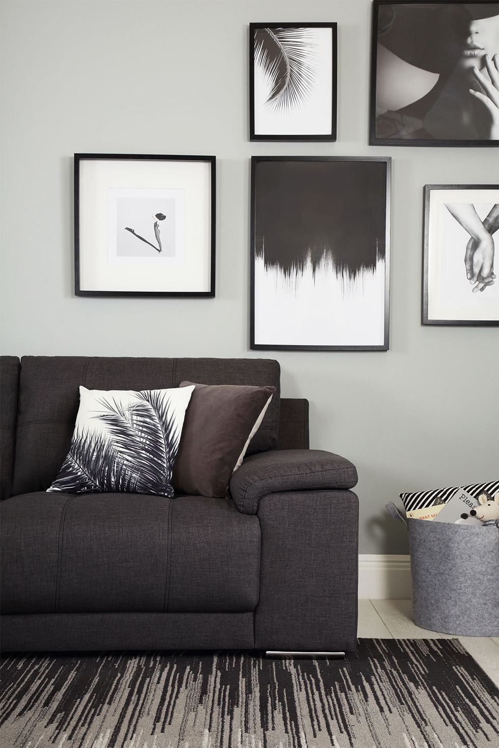 Living room with grey fabric sofa and gallery wall