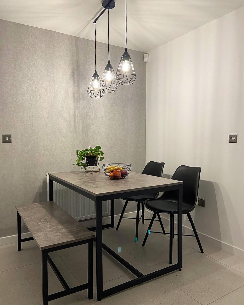 Breakfast area with industrial style dining set and pendant lights