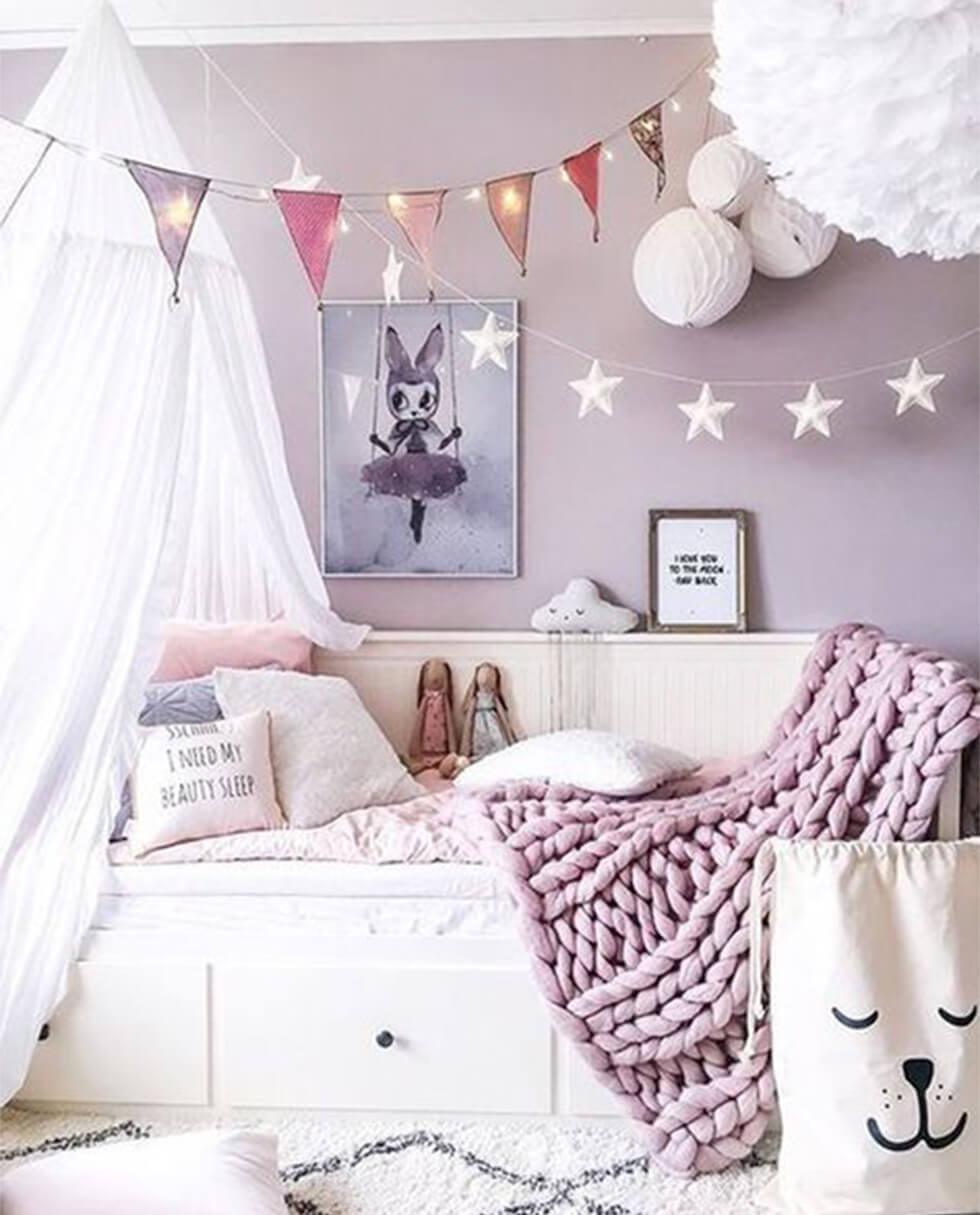 Lilac children's bedroom with canopy tent and soft toys