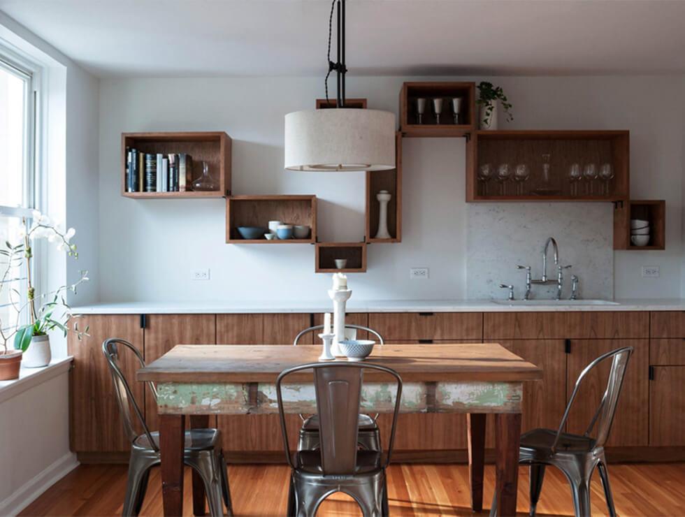 Dark wood floating shelves above a sink in a minimalist wooden dining room