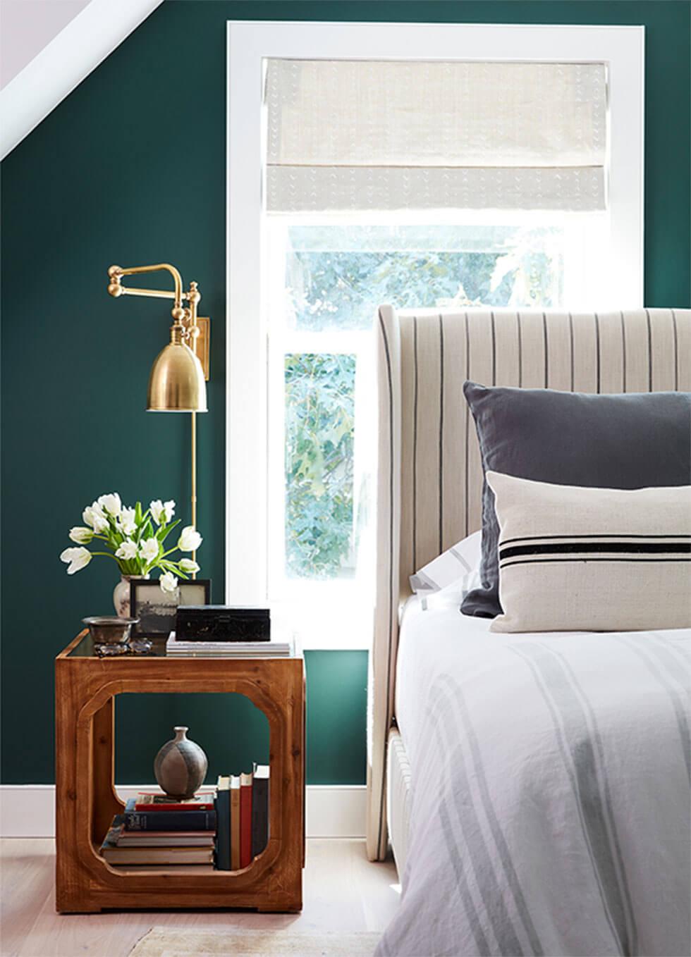 Bedroom feature wall in rich emerald green.