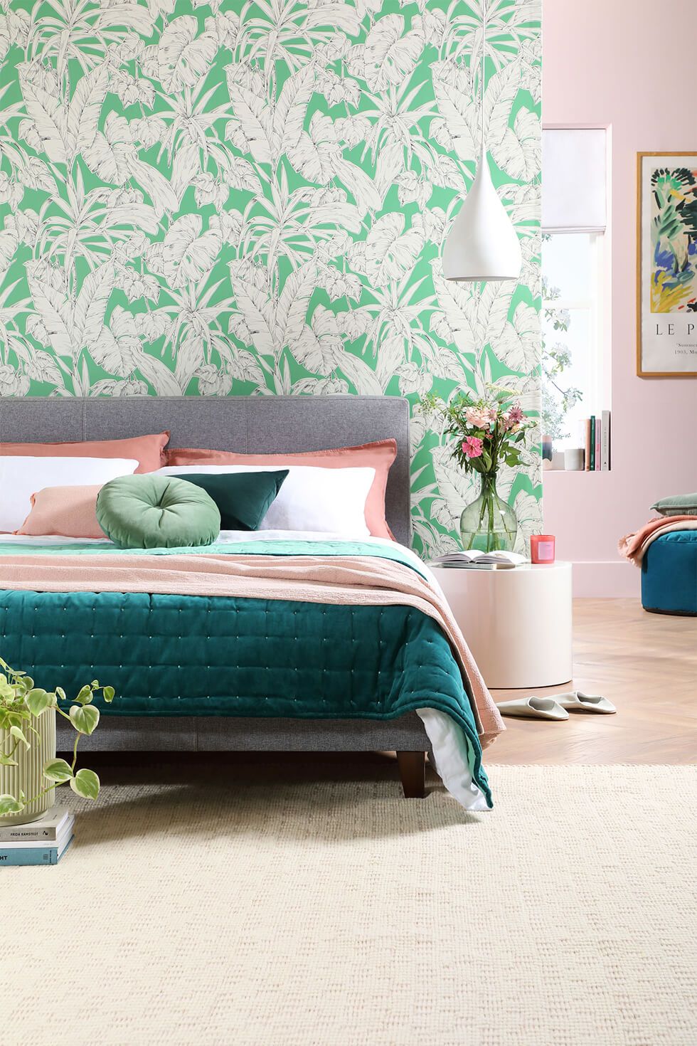 Bedroom with tropical green wallpaper and fabric bed