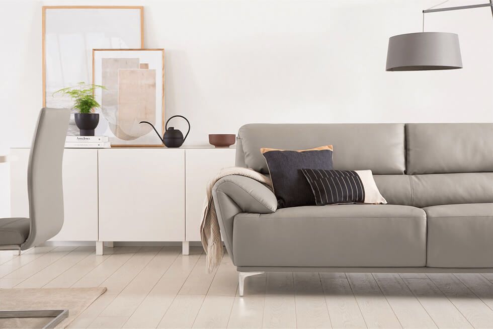 Minimalist earth tone living room with taupe sofa