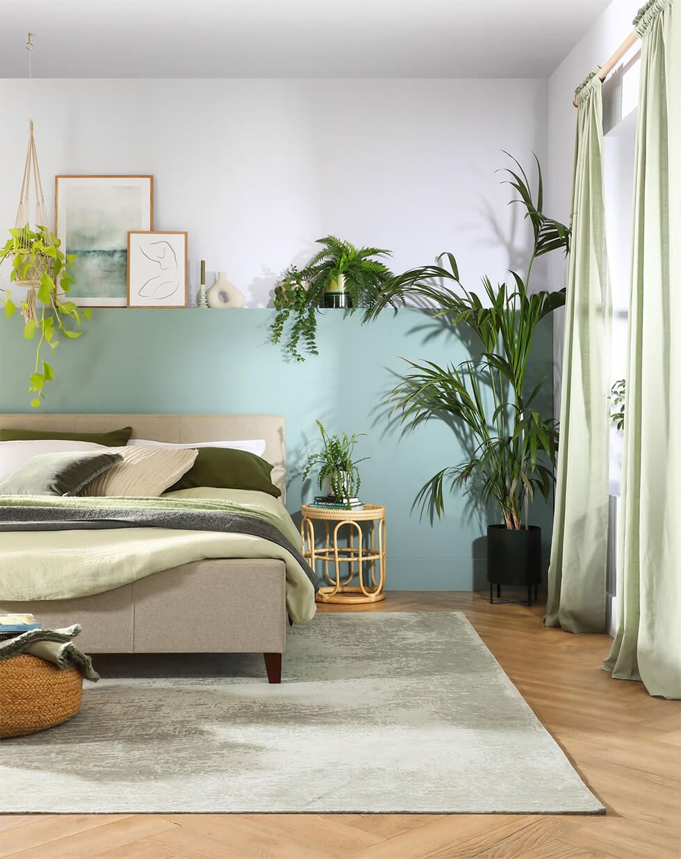 Green bedroom with eco-friendly paint and natural textures