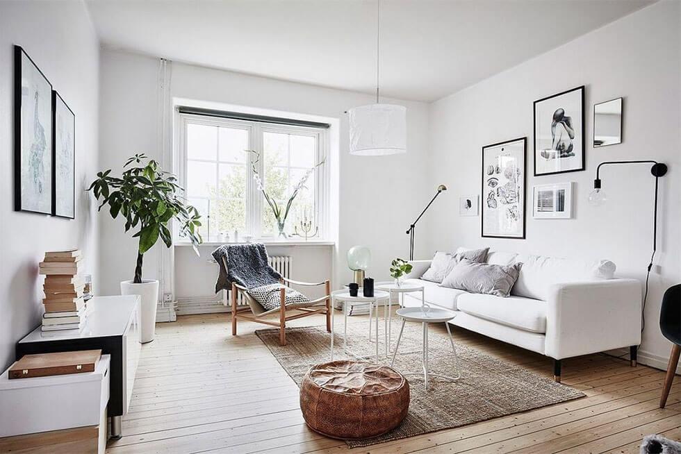 Neutral Scandinavian style living room with a white sofa and natural accessories