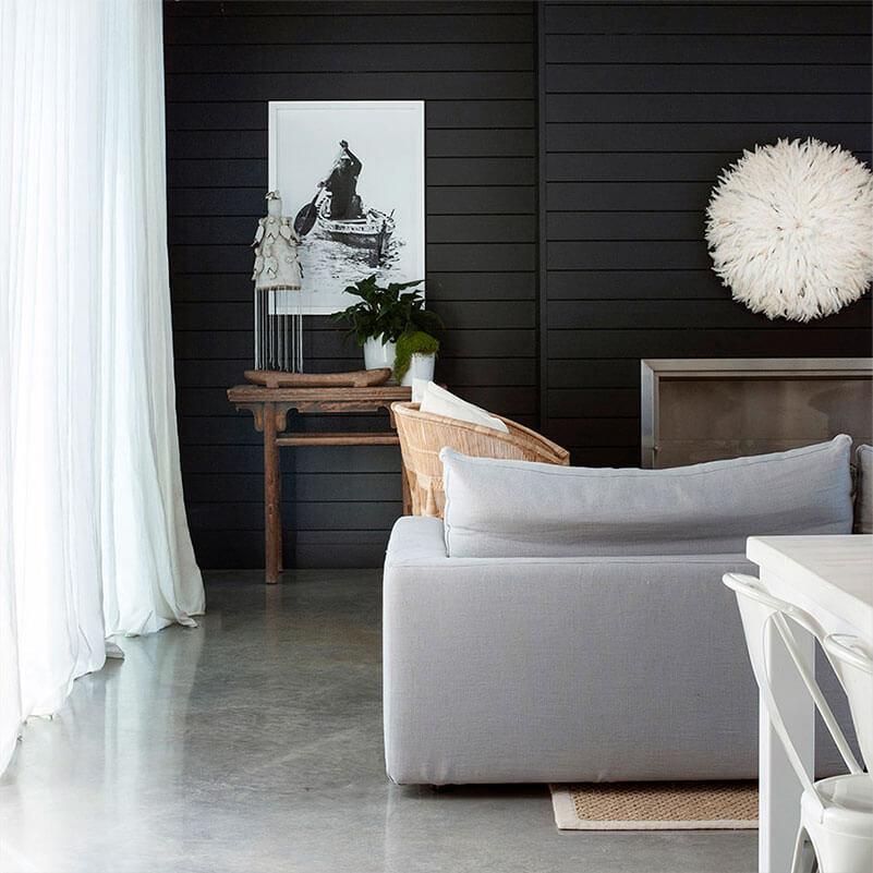 Neutral living room with a grey sofa in modern coastal style