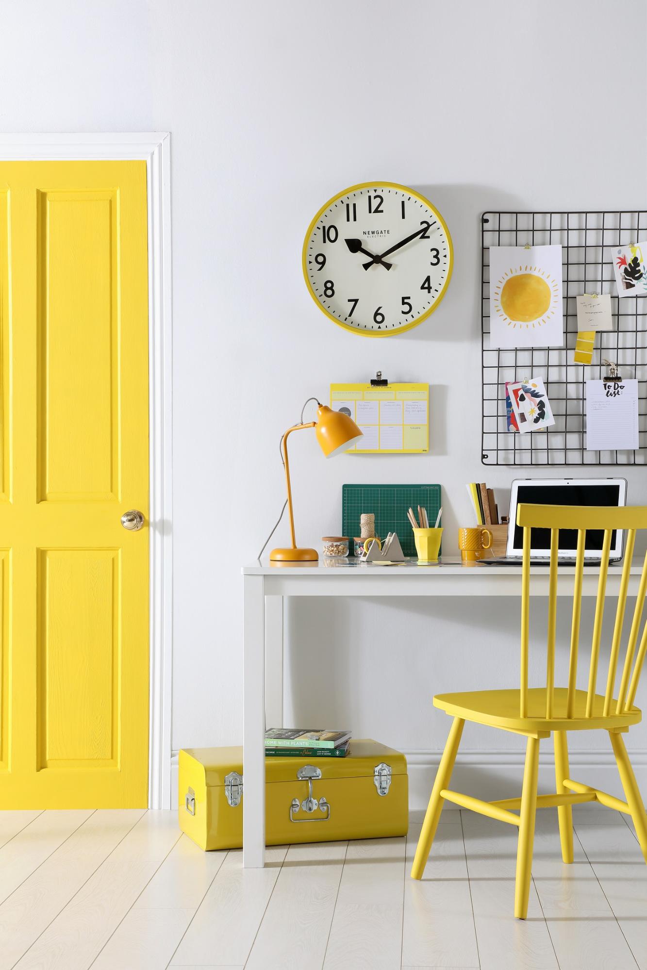 Yellow chair and door in a fresh and neutral home office