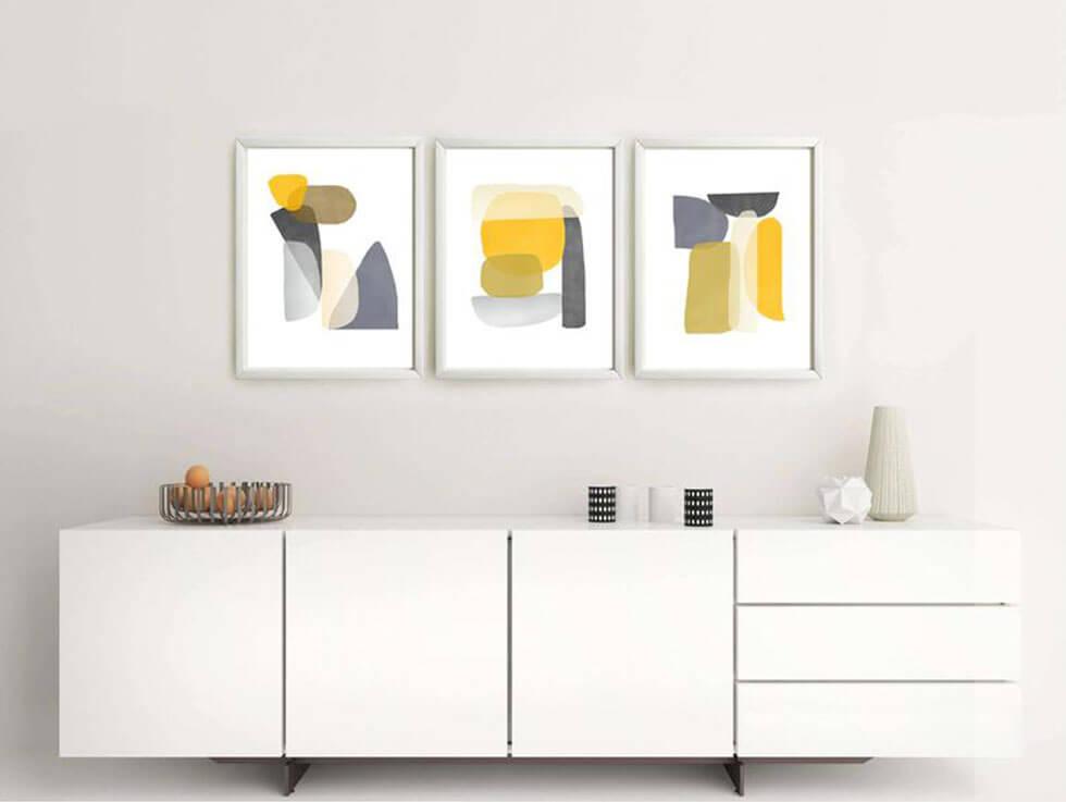 Yellow artwork in a neutral, modern setting