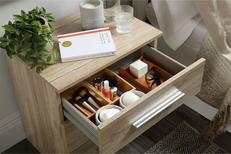 Bedside table with mini compartments in a small bedroom
