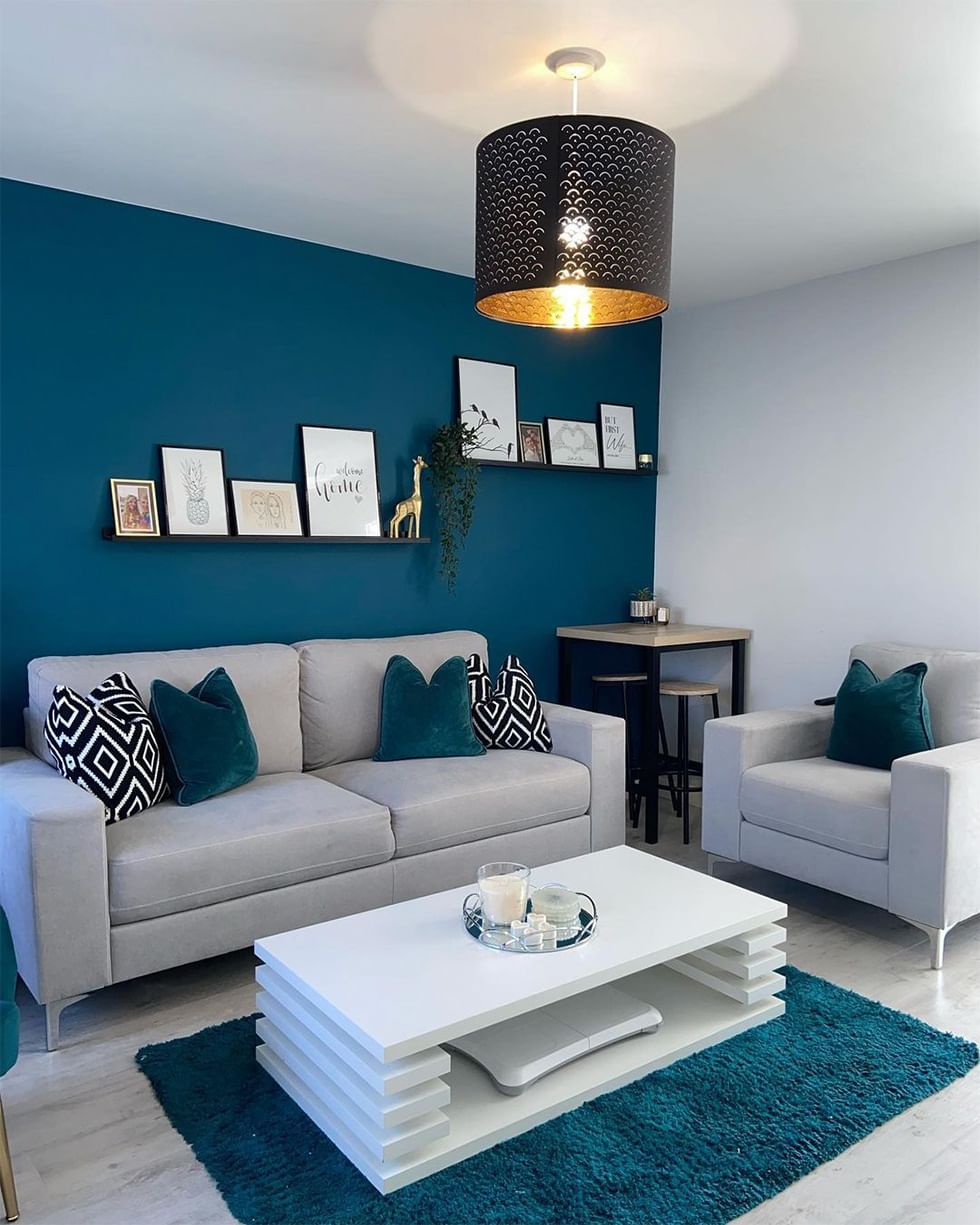 Teal living room with contemporary grey sofa