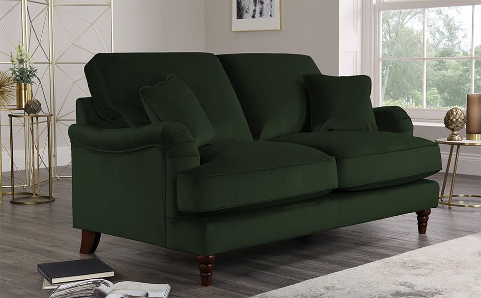 Green velvet sofa in grey living room