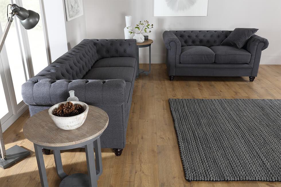 Furniture Choice grey fabric Chesterfield sofa set in a contemporary Scandinavian living room