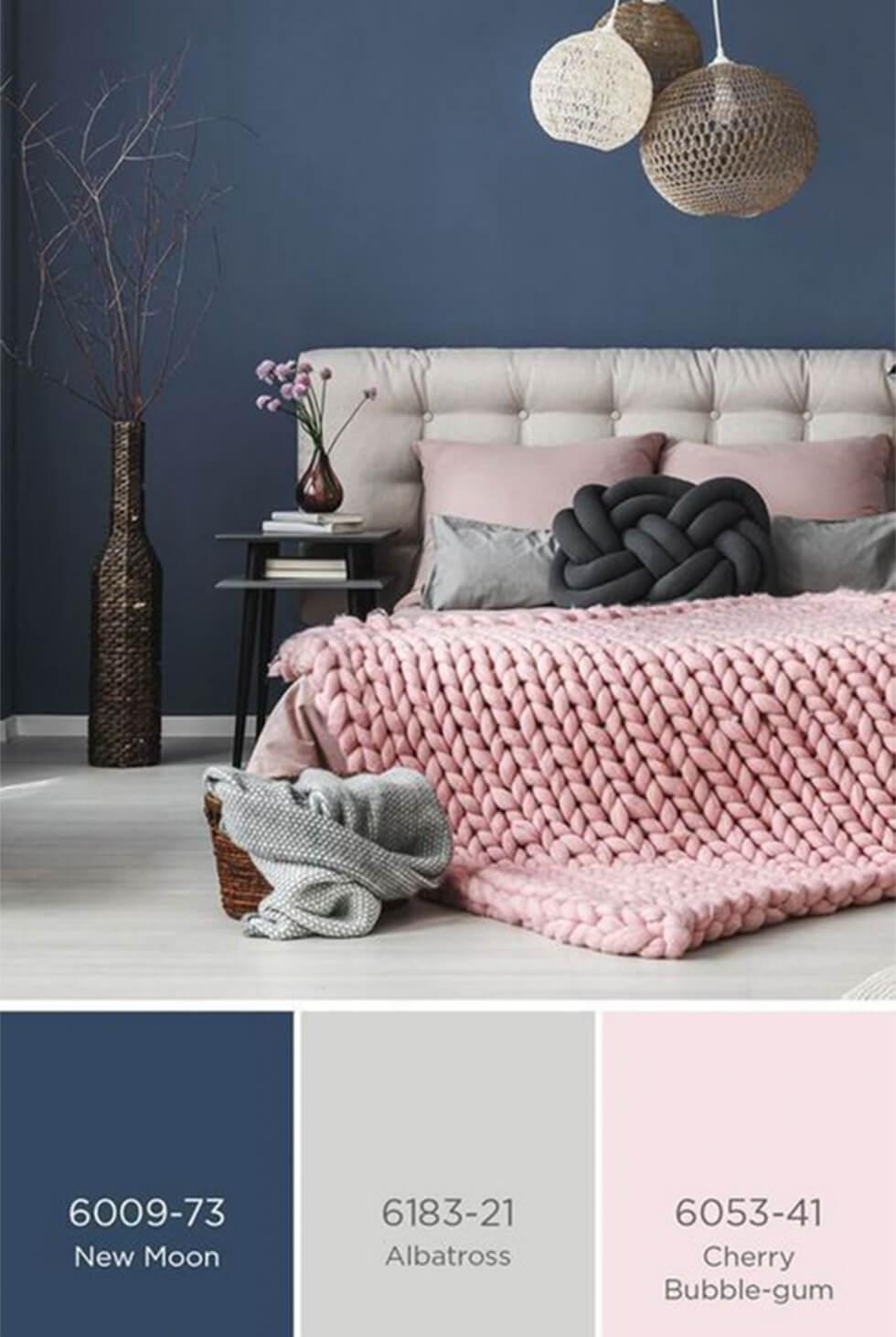 A contemporary blue bedroom with grey and light pink pastel hues