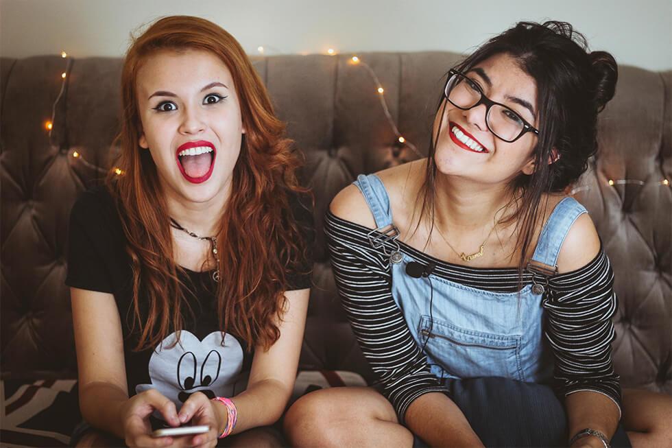 two girls hanging out enjoying mindful living.