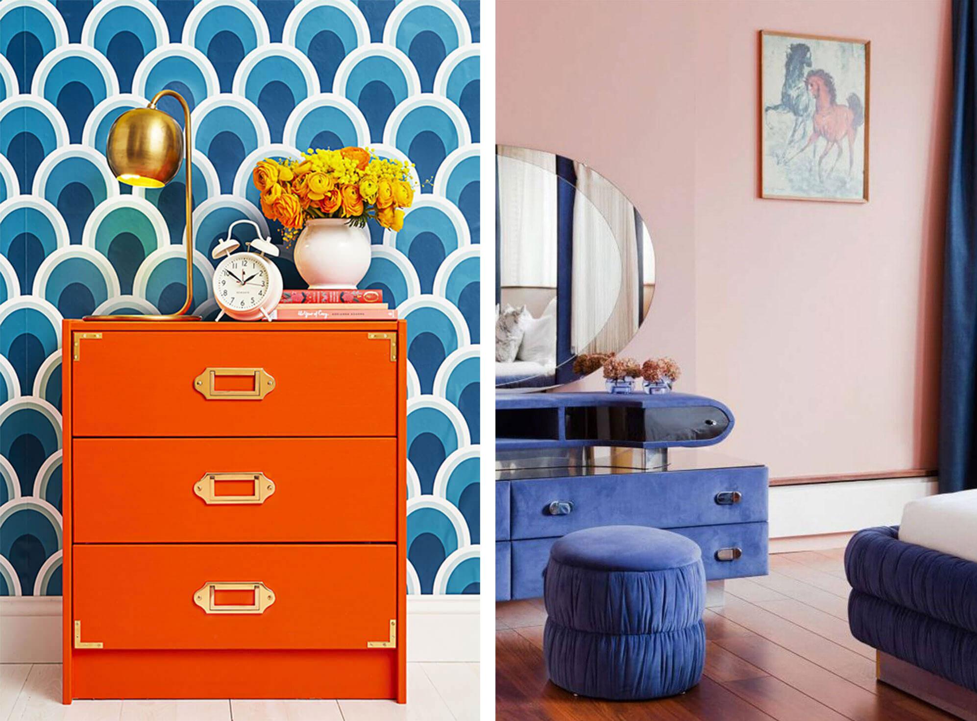 Vintage bright orange chest of drawers against blue patterned wallpaper