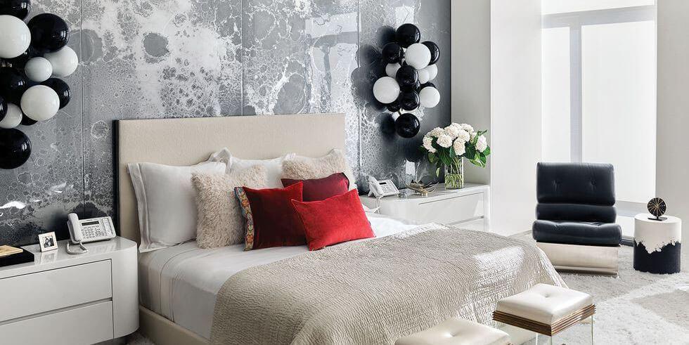 Modern bedroom with black and white balloon sconces and statement feature wall