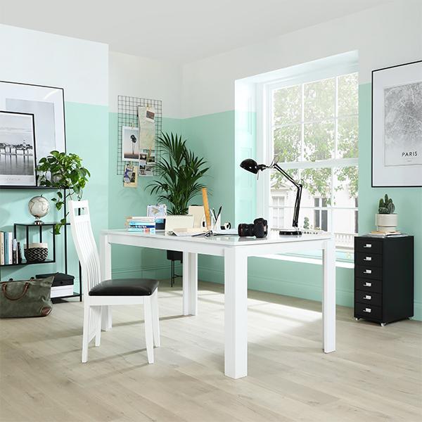 Colour blocked walls and white table and desk