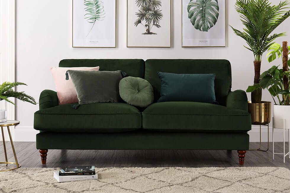 Green velvet sofa in a contemporary living room