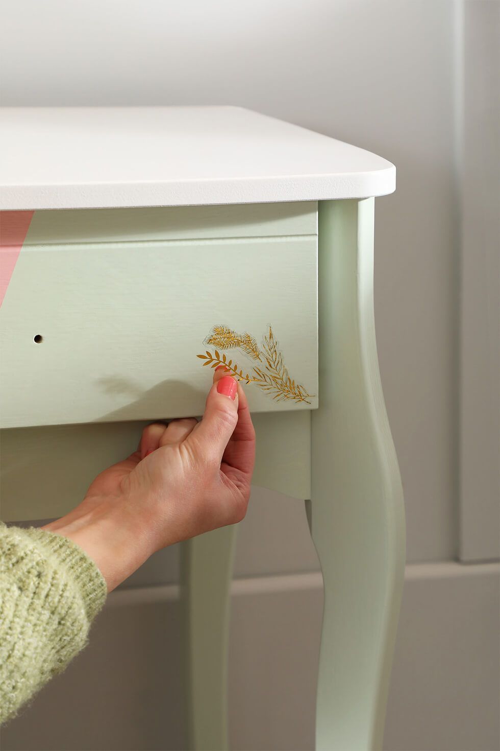 Add gold decal stickers to the drawer