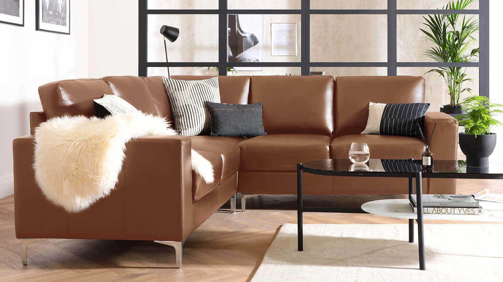 taupe tan sofa leather on oak floor