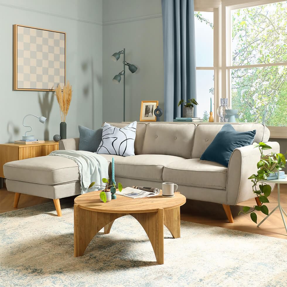 Light blue living room with grey sofa