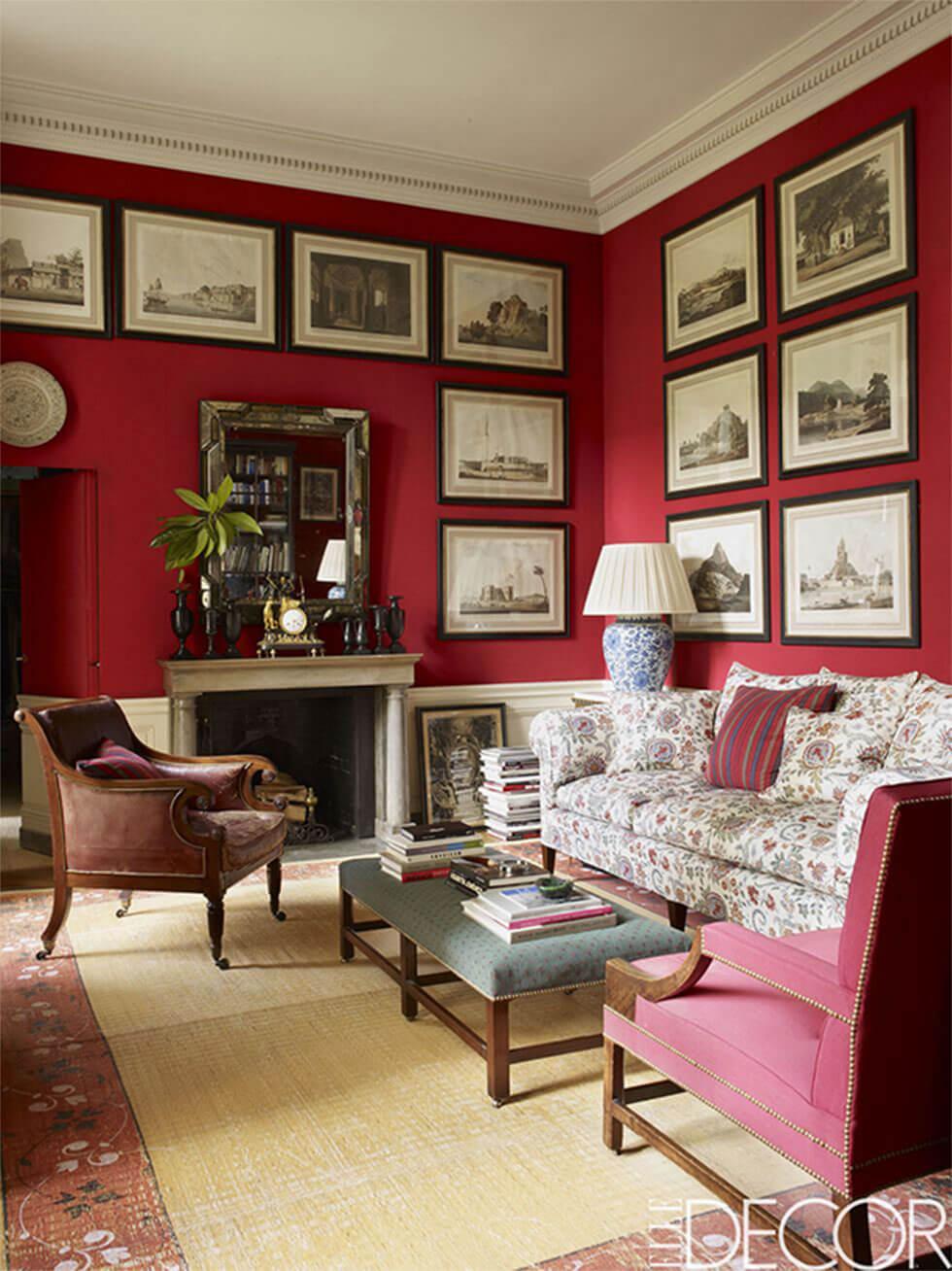 Classic red living room with a gallery wall and printed fabric sofas
