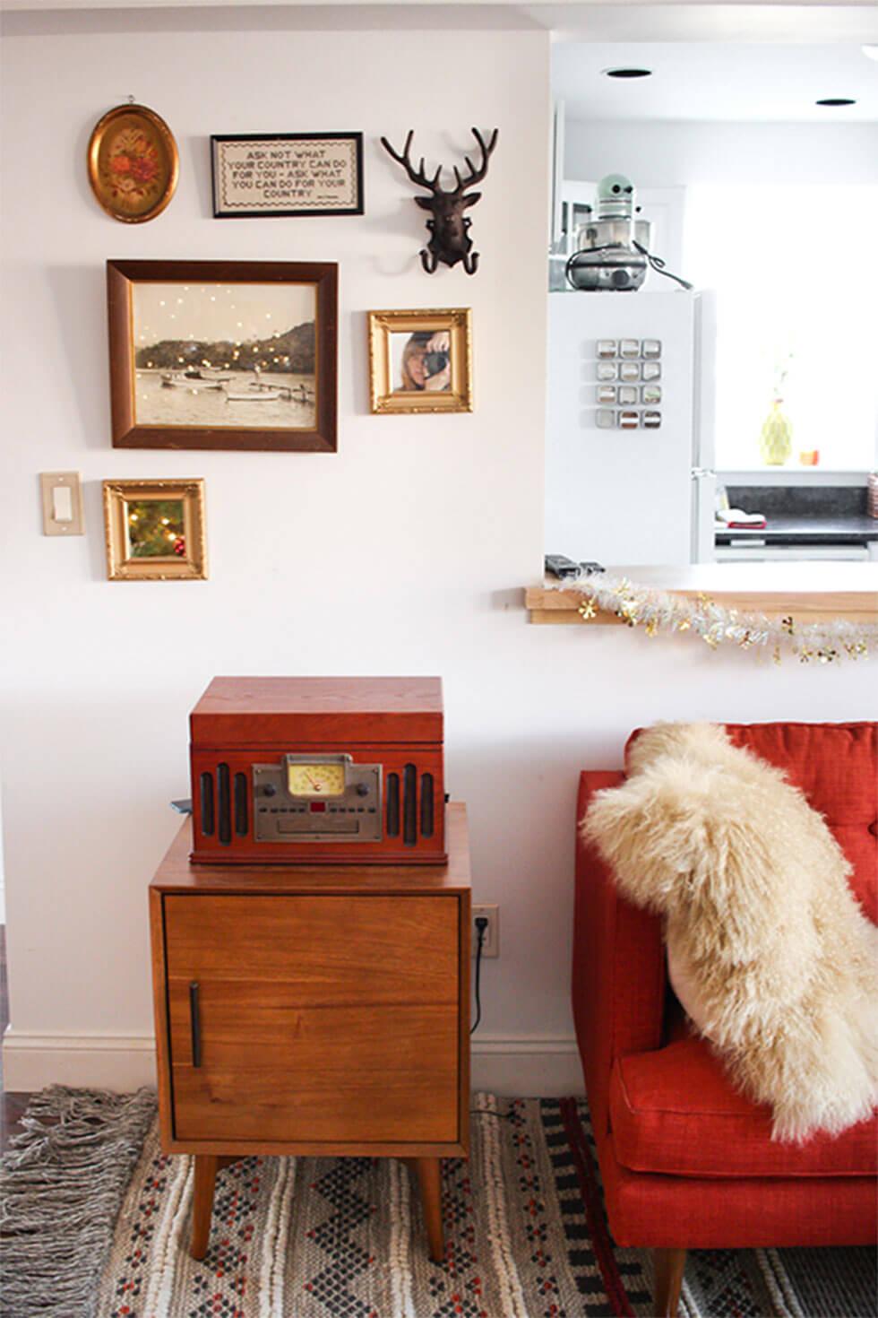 Vintage living room with a red sofa and a fur throw