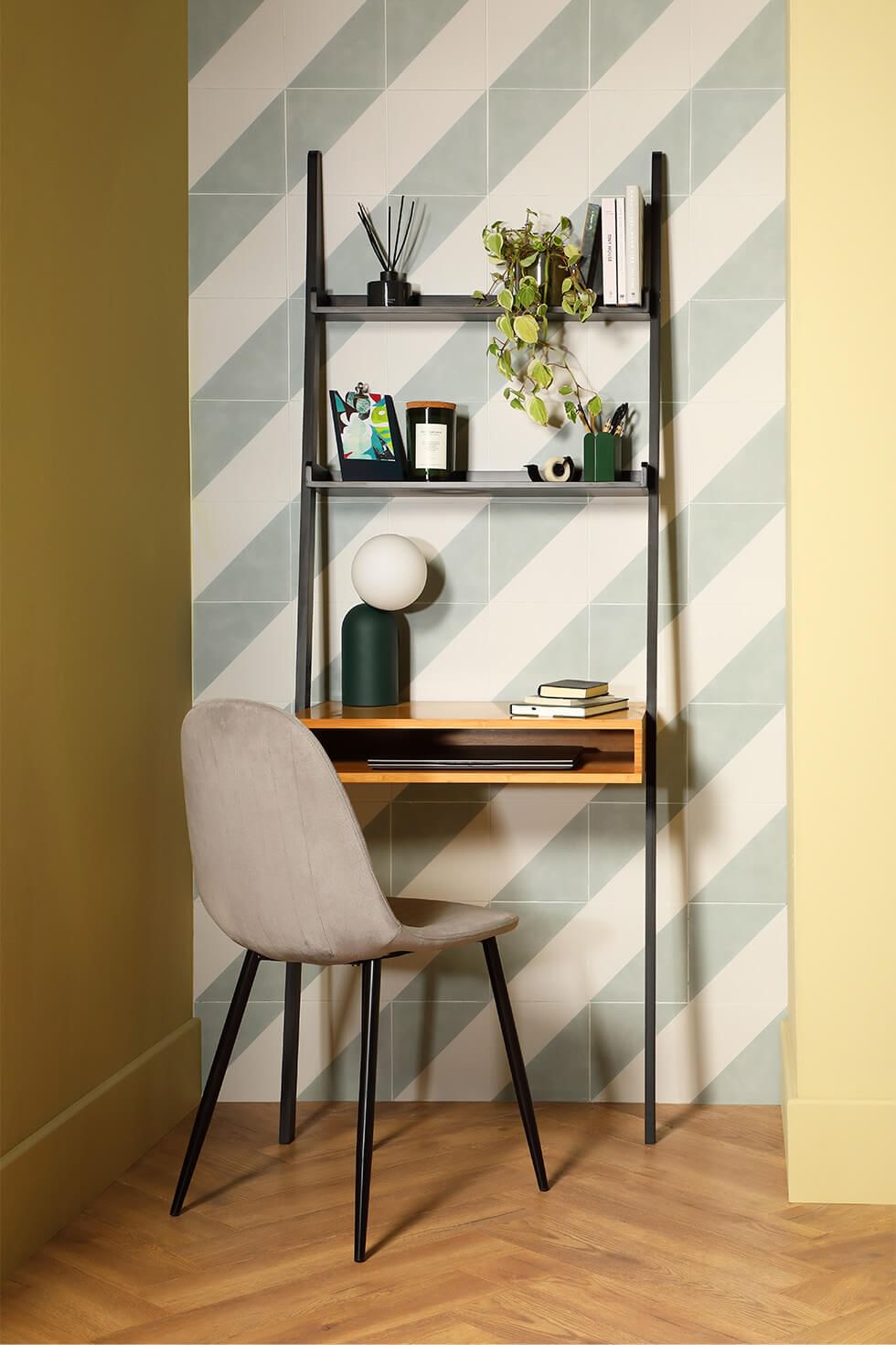 An alcove turned into an office or study area with a modern chair and desk