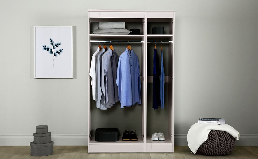 A classic white 3 door wardrobe with a hanging rail