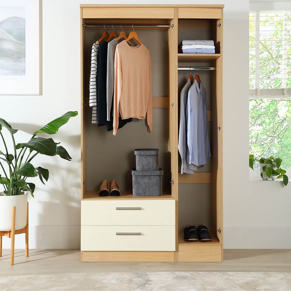 A wardrobe with two hanging rails, two drawers and space to keep shoes and small storage containers