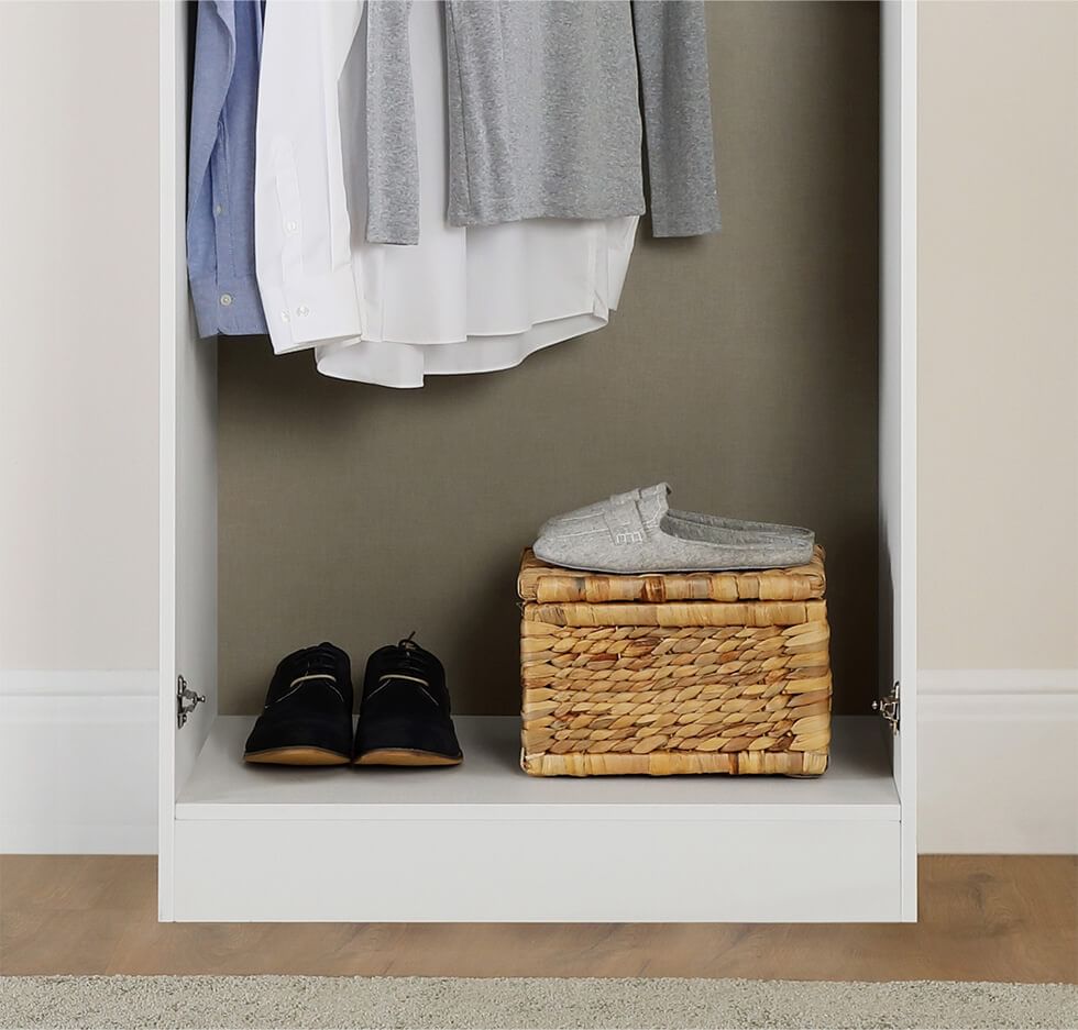Internal floor space in a wardrobe to keep shoes and a storage basket
