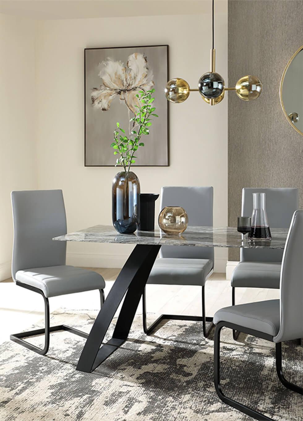 Dark neutral dining room with a marble dining table and grey leather dining chairs