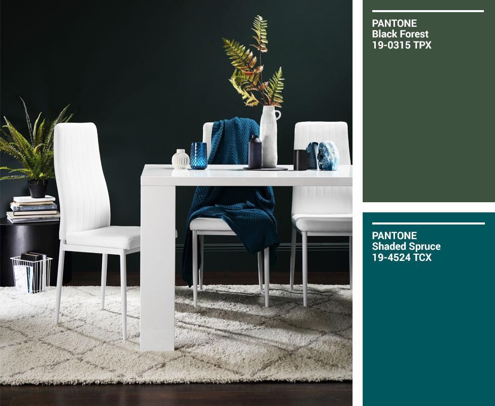 Collage of white wood dining set against a dark green wall.