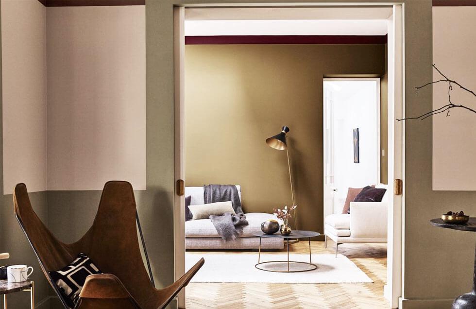 A warm beige interior with light and dark furniture.