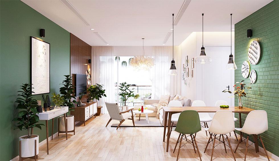 A calm living room, with sage walls, wooden details and pink chairs.